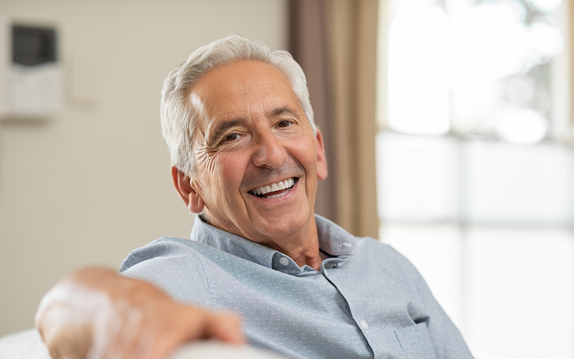 smiling older gentleman with face wrinkles